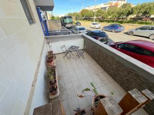 a balcony with potted plants and a view of a parking lot at Stardust in San Ġwann