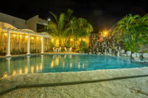 a swimming pool in a resort at night at Yahweh's Spring Retreat and Resort in Calamba +30 photos