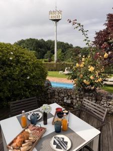 a table with a tray of food and a sign at SNÖ Pazo de Adrán in Milladoiro