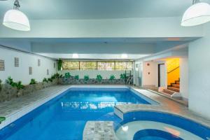 a large swimming pool in a house at Yahweh's Spring Retreat and Resort in Calamba