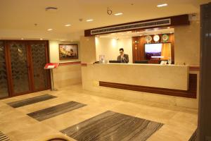 a man sitting at a bar in a hotel lobby at Almadiafa - المضيفه in Cairo +111 photos