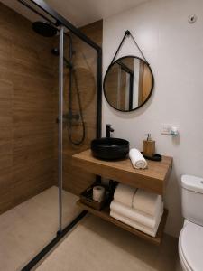 a bathroom with a sink and a mirror at Hostal Casa Miguel Marbella in Marbella +38 photos
