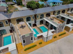 an aerial view of a house with a swimming pool at An An Pool Villa in Nong Prue