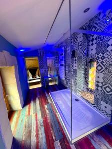 a large bathroom with a tub in a room at Logis de Cupidon in Châteauneuf-du-Rhône +20 photos