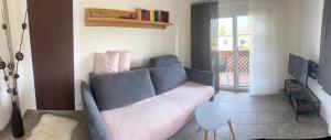 a living room with a couch and a table at Appartement Stichauner in Tschöran