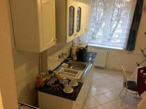 Kuchyňa alebo kuchynka v ubytovaní Írisz Apartman Budapest