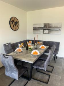 a dining room with a table and chairs at Appartement Dürnle Reißeck in Mühldorf +23 photos