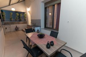 a dining room with a table and chairs at Unique Kos Apartment in Ampavris