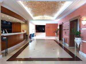 a hallway of a building with a hallway at Hotel Olympia Palace in Olympia