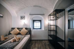 a living room with a couch and a window at 4 Rooms in Maribor