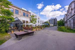 a bench sitting in the middle of a street at Sõle Studios by RevalHome in Tallinn