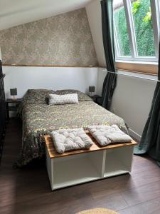 a bedroom with a bed with towels on it at L atelier de Jules in Lyon