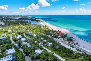 an aerial view of the beach and the ocean at Pink Shell Sanibel in Sanibel