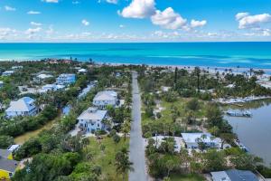 an aerial view of a resort with the beach and houses at Pink Shell Sanibel in Sanibel