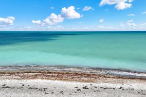 a view of the ocean from the beach at Pink Shell Sanibel in Sanibel