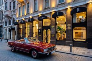 a red car parked in front of a building at Miapera Hotel & Spa - Special Class in Istanbul