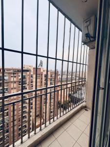a balcony with a view of a city at Saffron Nest in Zirakpur