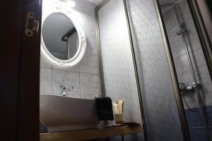 a bathroom with a sink and a mirror at Villa Socrates in Vasilikos +32 photos