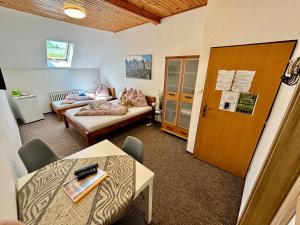 a living room with a couch and a table at Villa Holiday Tatry in Nová Lesná