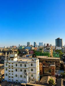 a view of a city with a white building at Saba Guest House in Kolkata