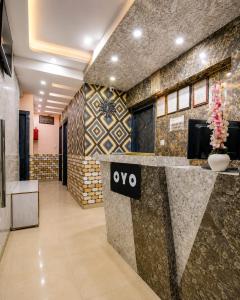 a lobby with a wvp sign on a wall at Saba Guest House in Kolkata