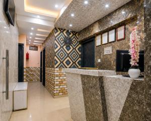 a lobby with a reception desk in a building at Saba Guest House in Kolkata