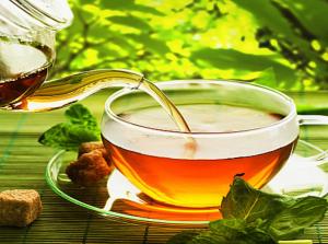 a cup of tea sitting on a table at Hotel Rosewood Suites Near Delhi IGI Airport in New Delhi