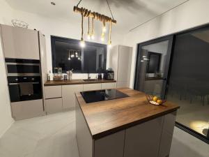 a kitchen with a sink and a counter top at Villa LiRa Star Bar Montenegro - Exclusive Adriatic Villa with Private Pool Starry Sky Lounge in Stari Ulcinj