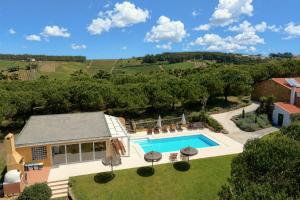 an aerial view of a house with a swimming pool at Quinta Raposeiros - Ocean View CountryHouse Ericeira in Santo Isidoro
