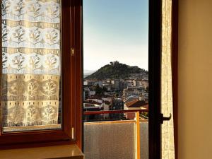 a window with a view of a city at La Casa del Benessere in Campobasso