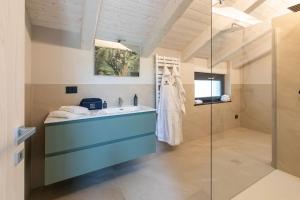 a bathroom with a sink and a shower at La Collina delle Rondini in Boves +36 photos