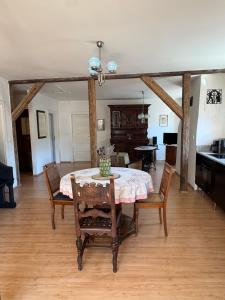 a dining room with a table and chairs at Apartmán Bonaparte in Loket +4 photos