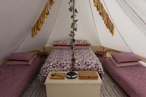 a bedroom with a bed in a tent at "Exclusive" Glen Farm Glamping in Cromer