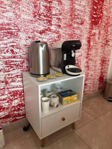 a counter with a coffee maker on top of it at Ferienwohnung Fatlume No 4 in Bad Honnef am Rhein