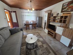 a living room with a couch and a table at Apartments Drita in Baška