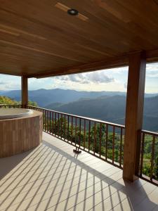 a balcony with a view of the mountains at Tramont in Ban Huai Khai