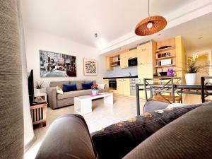 a living room with a couch and a table at Departamento Corriquia in Playa Blanca +15 photos