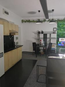 a kitchen and dining room with a table and a dining room at Apartament Pod Kukułką PARKING FREE in Kłodzko