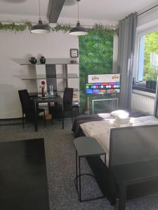 a living room with a table and a dining room at Apartament Pod Kukułką PARKING FREE in Kłodzko