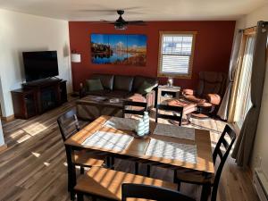 a living room with a couch and a table at YellowstoneMigrant in Emigrant