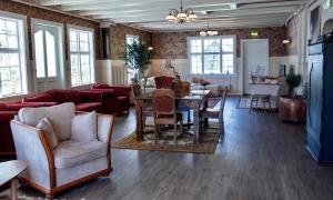 a living room with a table and chairs at Valldal Fjord Lodge B&B in Valldal