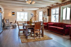 a living room with a table and a couch at Valldal Fjord Lodge B&B in Valldal