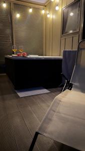 a room with two glasses of wine on a table at HappyPlace - Kolpa PremiumMobileHome in Metlika