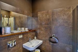a bathroom with a sink and a mirror at A Casa Armenia B&B in Turin