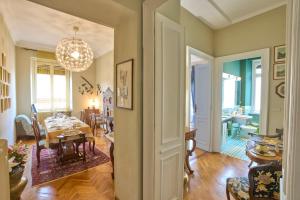 a dining room and living room with a dining table at A Casa Armenia B&B in Turin +7 photos