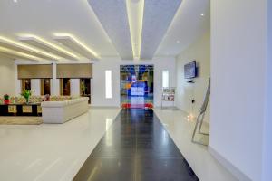 a living room with a couch and a lobby at Banari Regency by Summit in Namchi