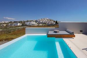 a house with a swimming pool with a view at Evira Suites in Pyrgos