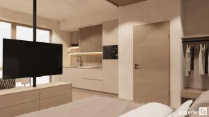 a living room with a flat screen tv on a wall at Augusta Apartments in Fliess