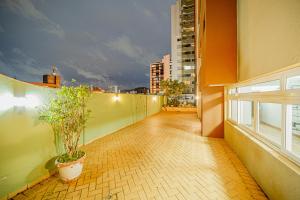 an apartment balcony with a view of a city at Cinema no Quarto: Smart TV 65", Piscina e Colado no Shopping! in Joinville +15 photos