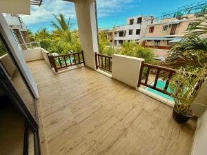 a balcony of a condo with a view of the street at Villa Luck in Trou aux Biches +14 photos